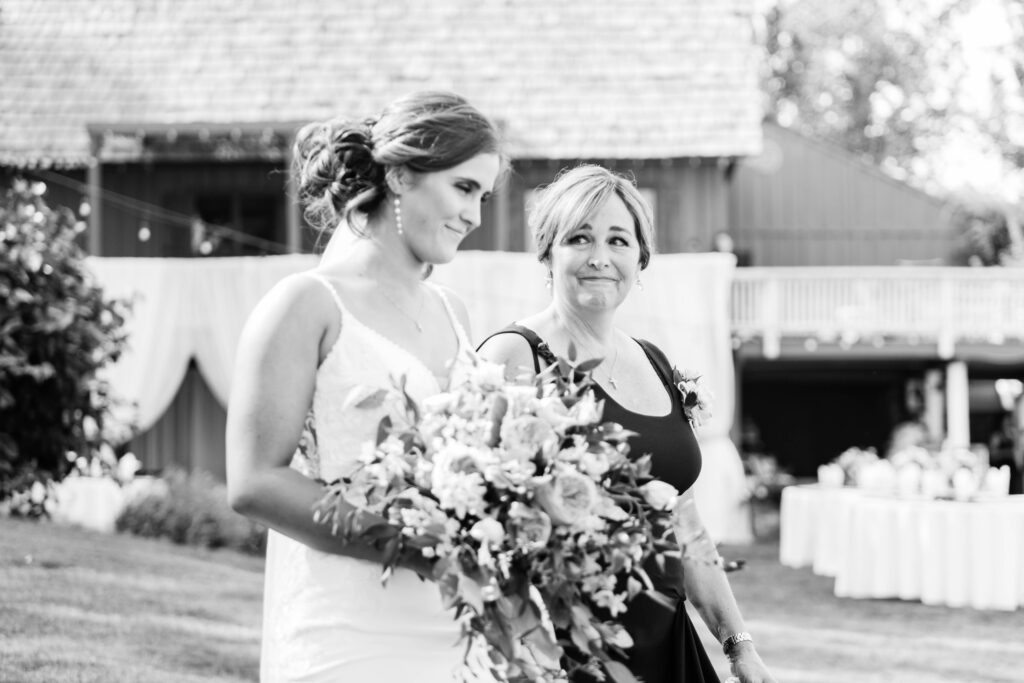 Boise wedding photographer captures bride being walked down aisle by mother