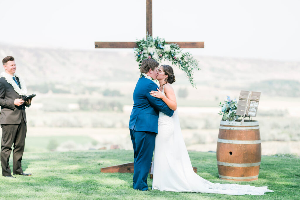 Boise wedding photographers capture bride and groom kiss