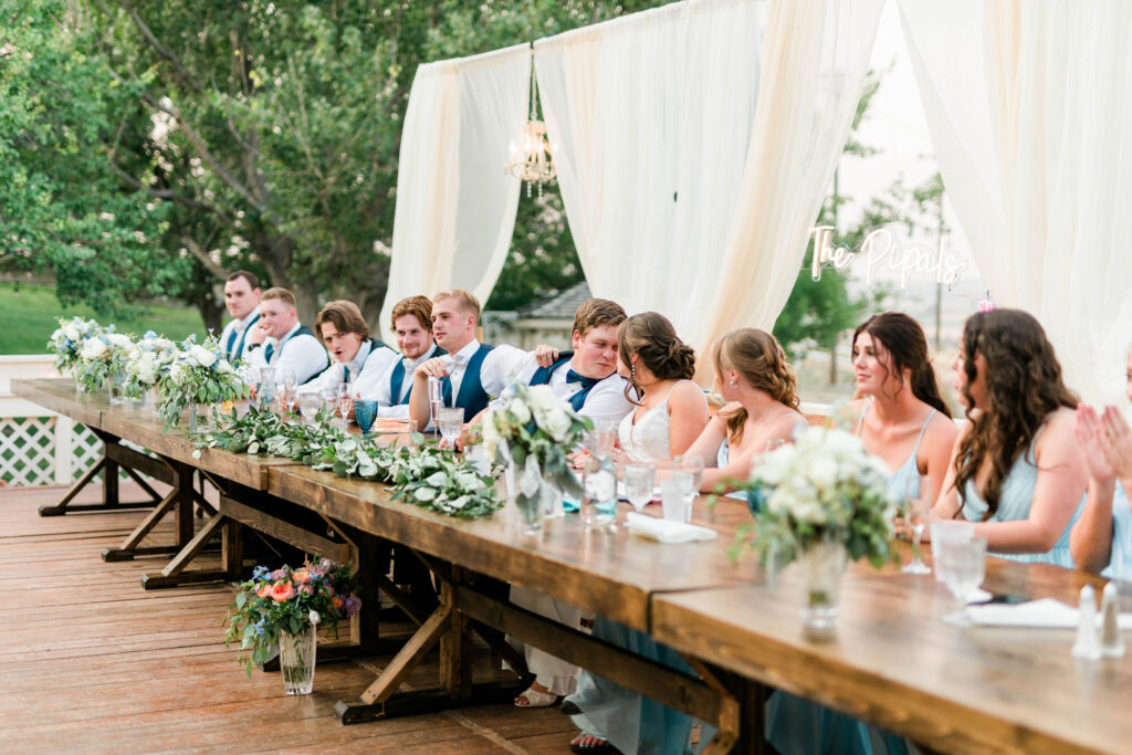 Boise wedding photographers capture couple celebrating recent marriage at reception