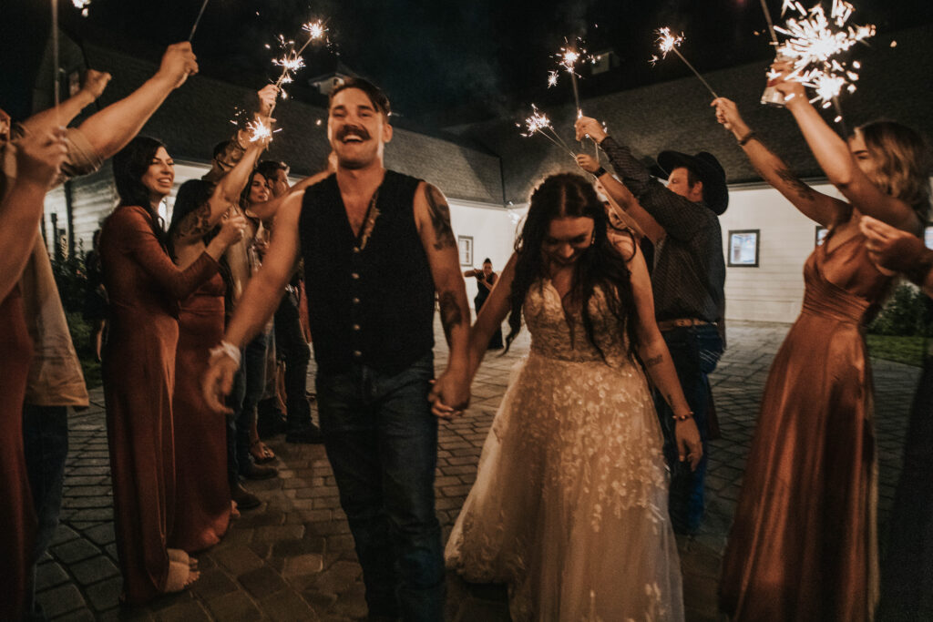 Boise wedding photographer captures bride and groom leaving during sparkler exit
