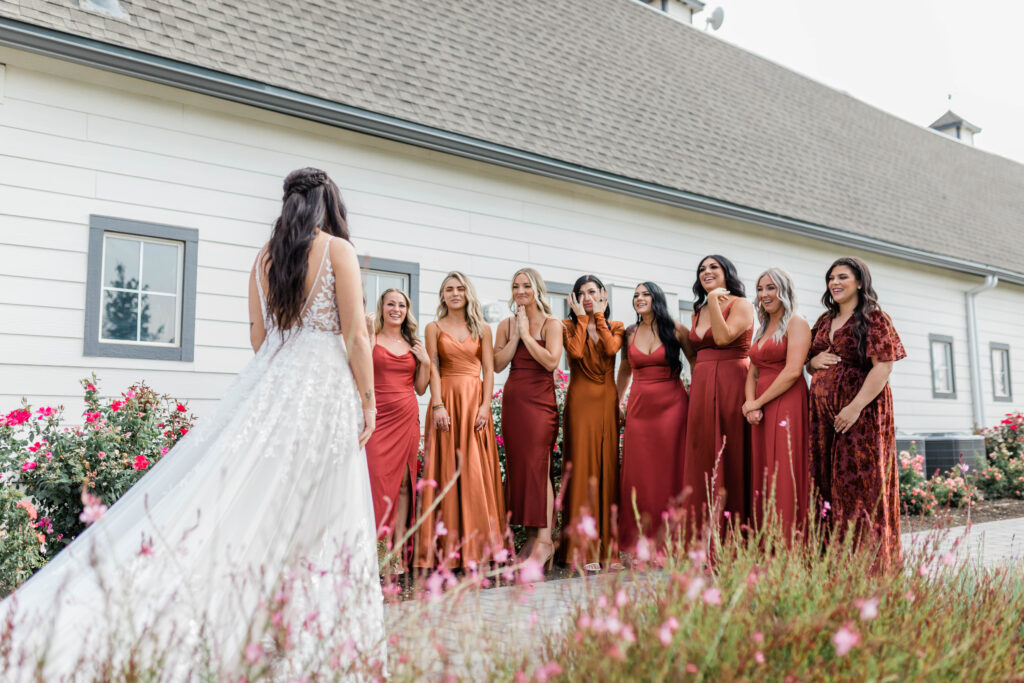 Boise wedding photographer captures bride during first look with bridesmaids