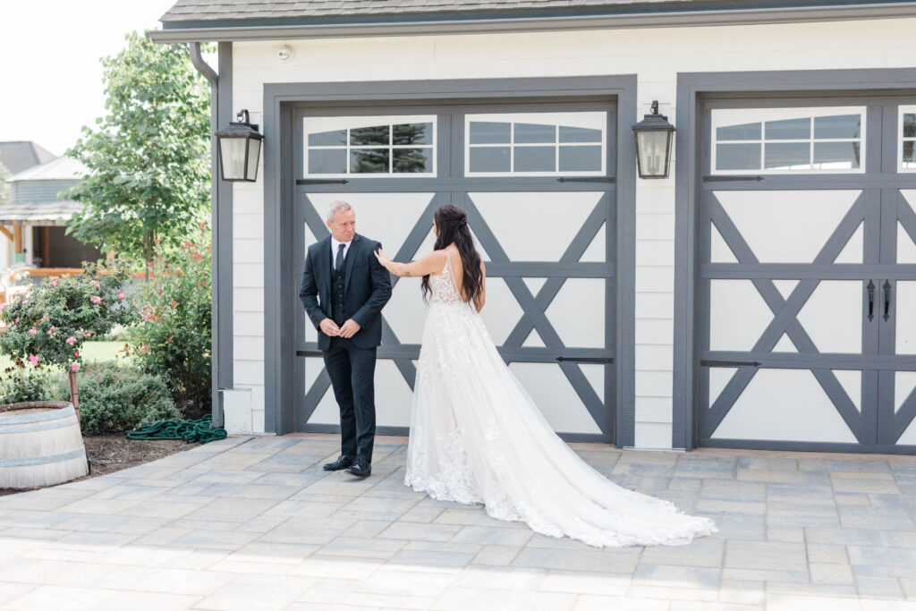 bride walking up to father during first look at wedding