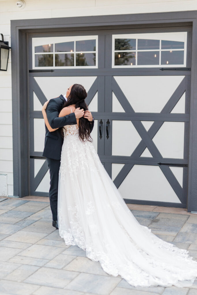 Boise wedding photographer captures bride hugging father during first look