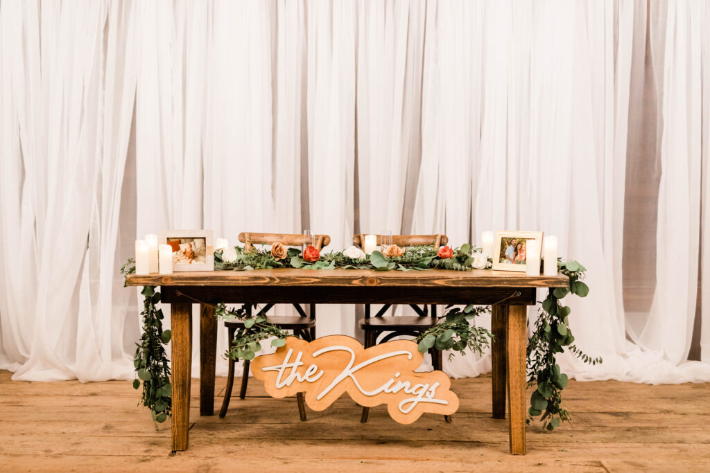 Boise wedding photographer captures sweetheart table at Mint Barrel Barn wedding