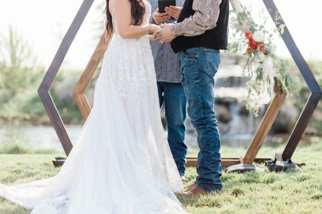 Boise wedding photographer captures bride and groom standing together at ceremony