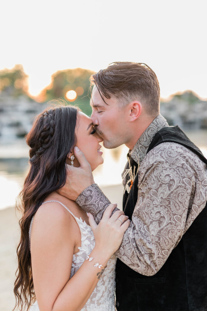Boise wedding photographer captures groom kissing bride's forehead