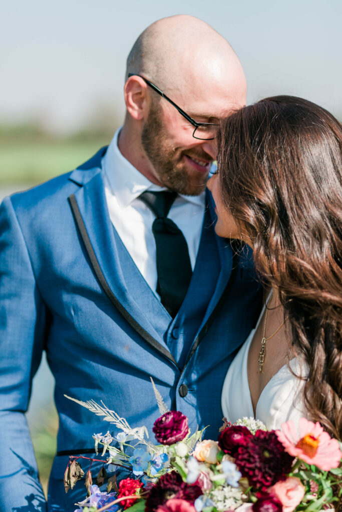 Boise wedding photographer captures couple kissing before reception