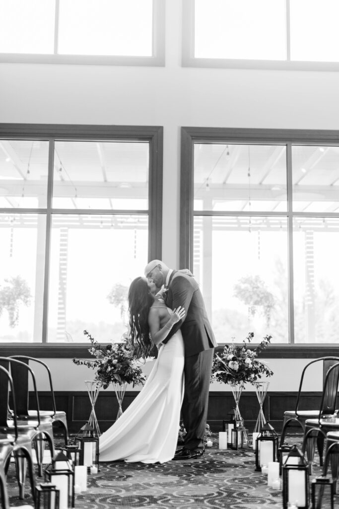 Boise wedding photographer captures couple kissing after wedding ceremony
