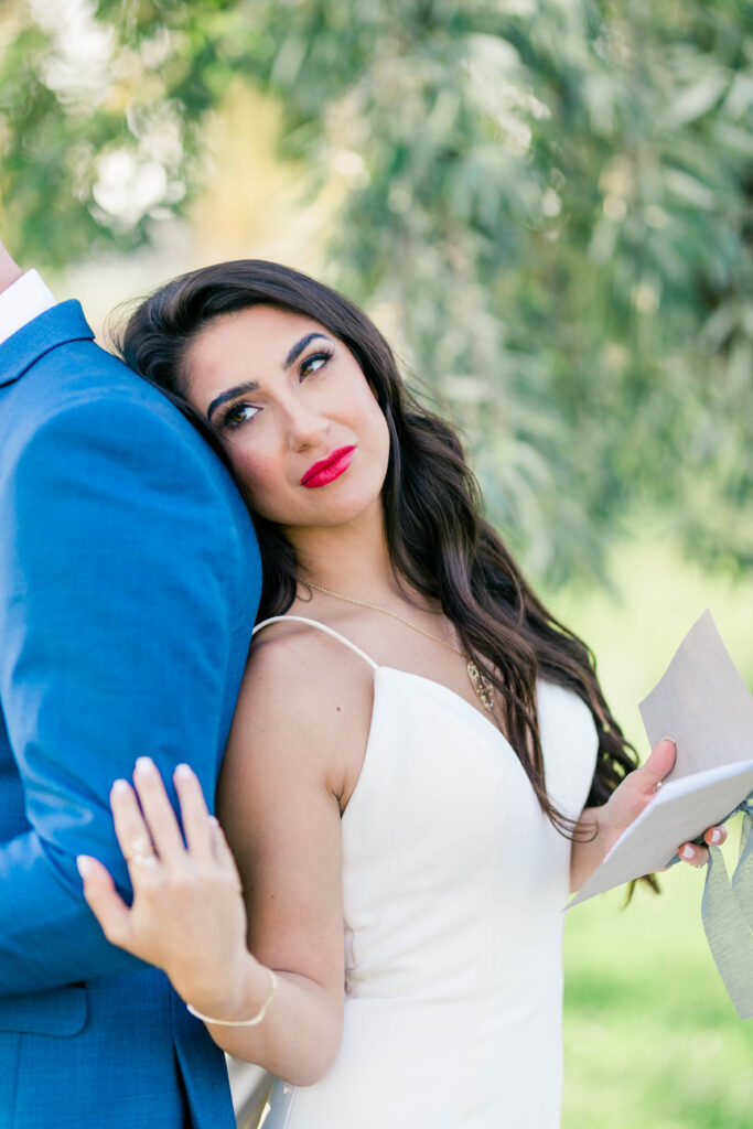 Boise wedding photographer captures bride leaning on groom after private vow reading