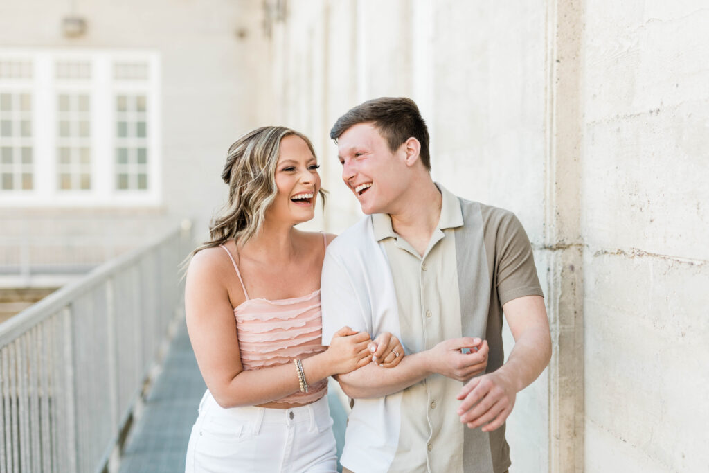 Boise wedding photographer captures couple walking together and laughing during Swan Falls engagements